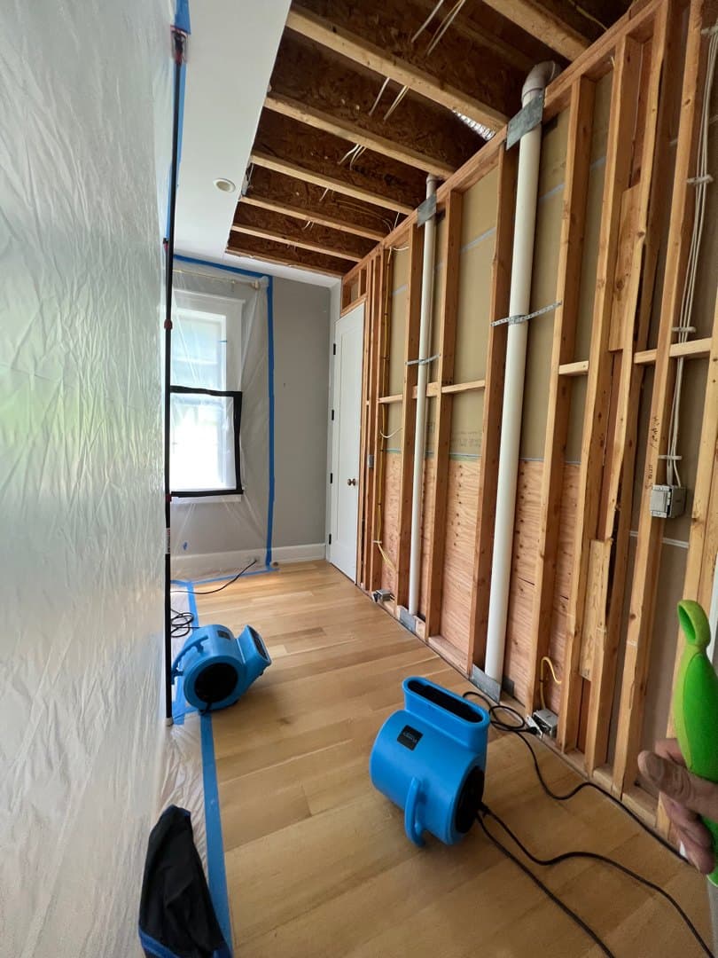 Water-damaged wall opened and dried in a Litchfield, CT home, then restored