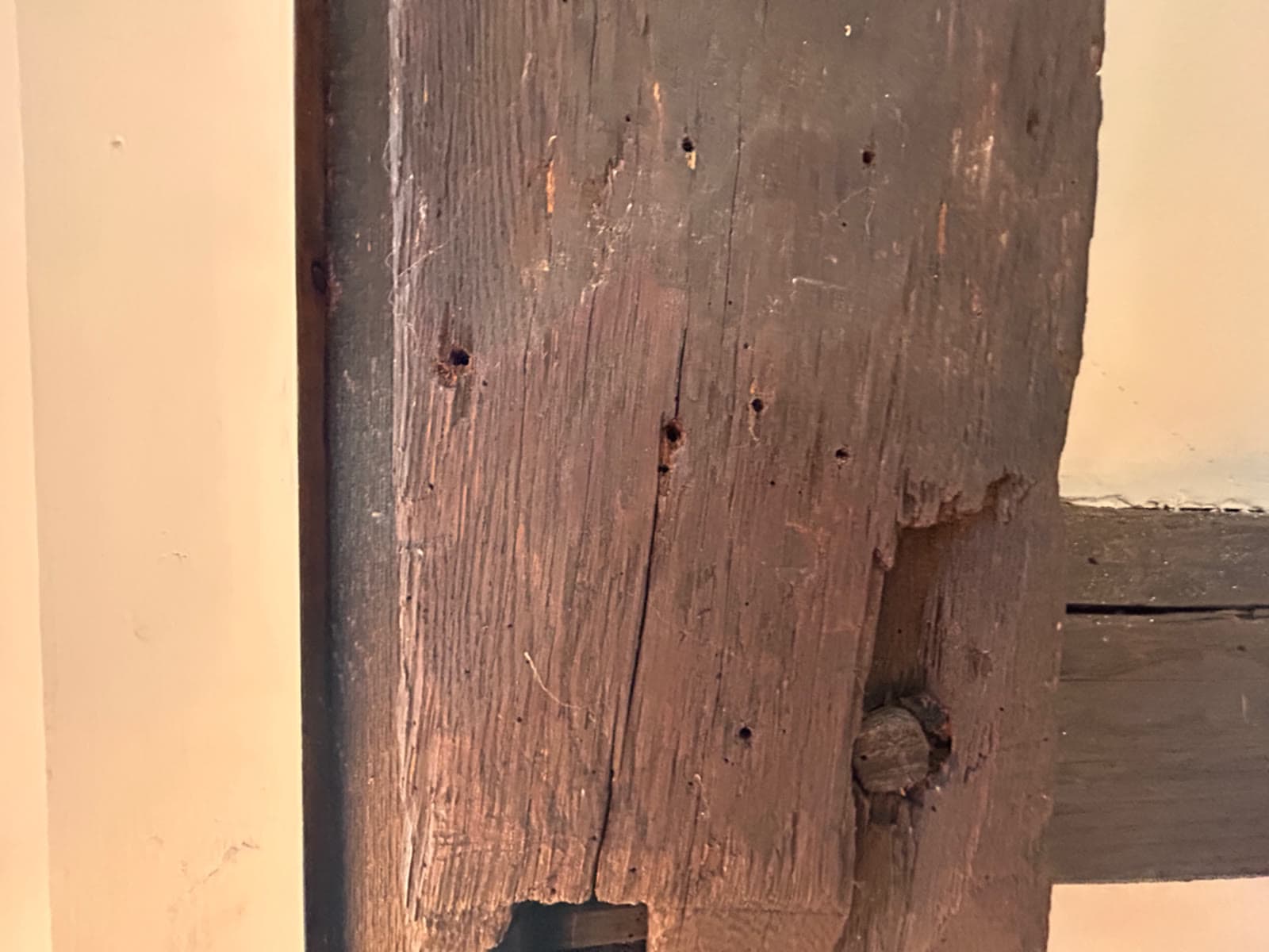 Aged structural timber post in a Weston, CT great room before soda blasting