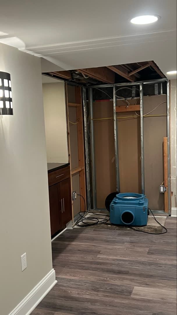 Dark mold growth where the ceiling meets a wall column in a basement playroom in Westport, CT
