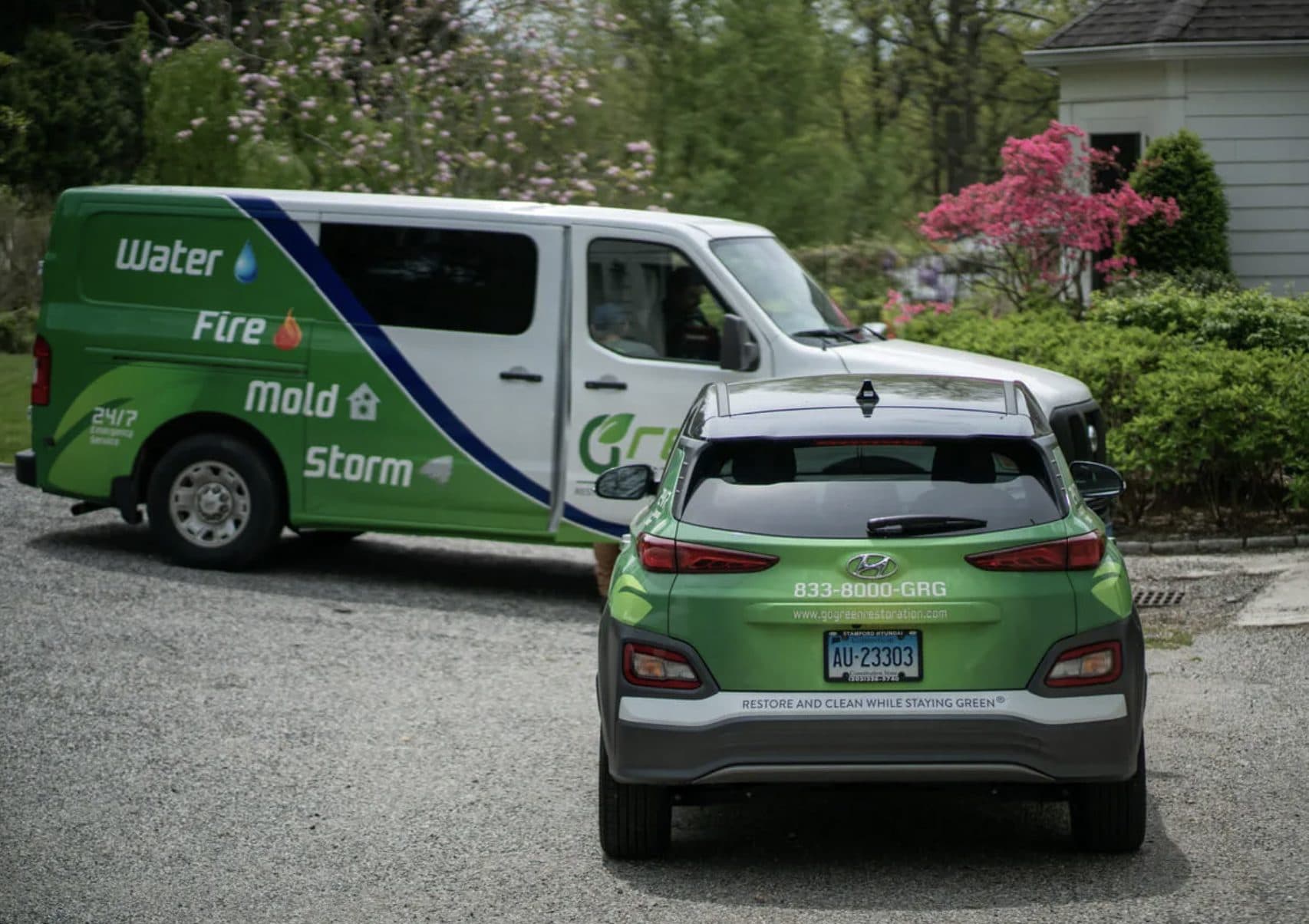 Green Restoration branded fleet vehicles ready for emergency water damage response in Yonkers NY