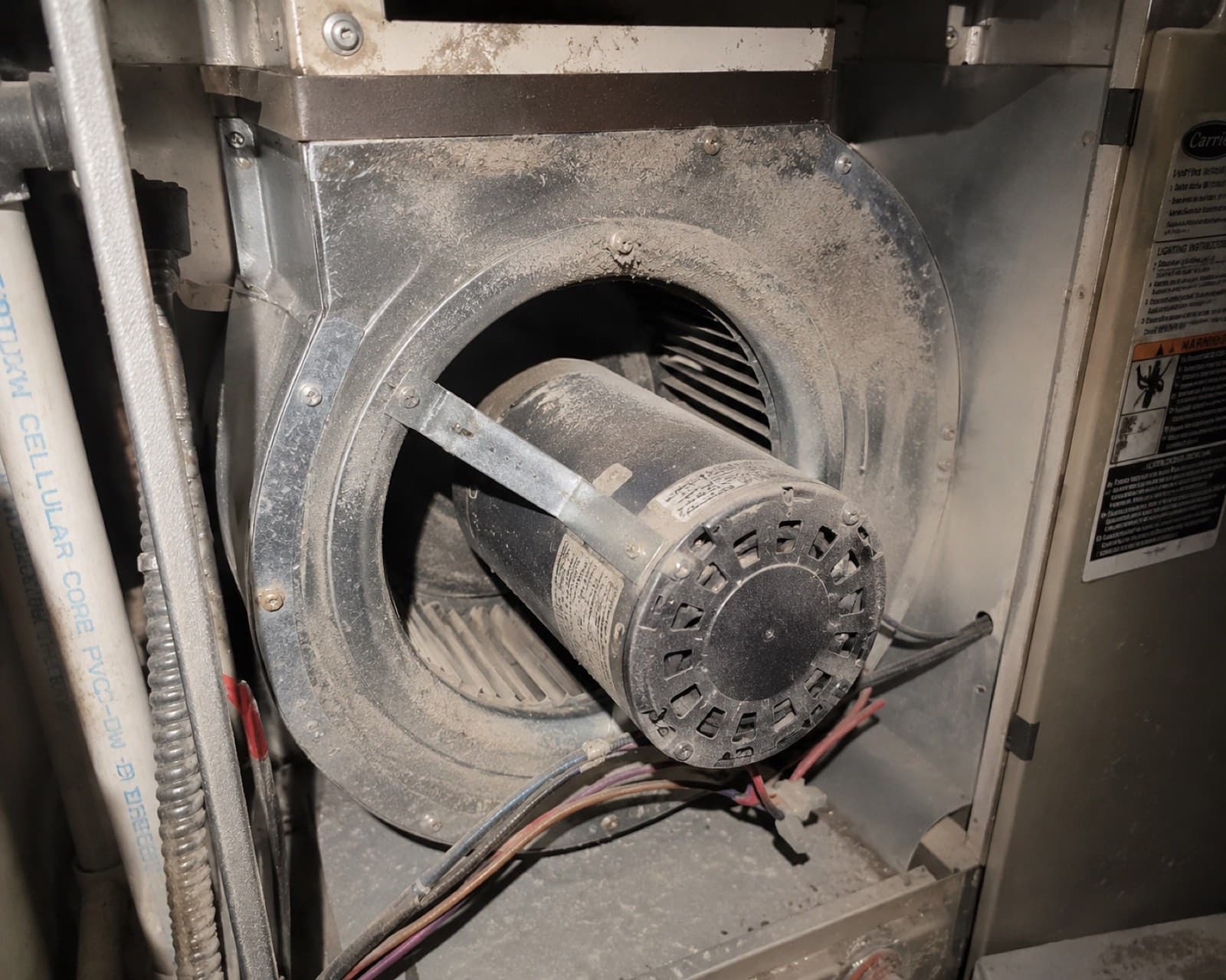 Blower housing and motor area packed with dust that recirculates through the home, before cleaning the housing and motor area