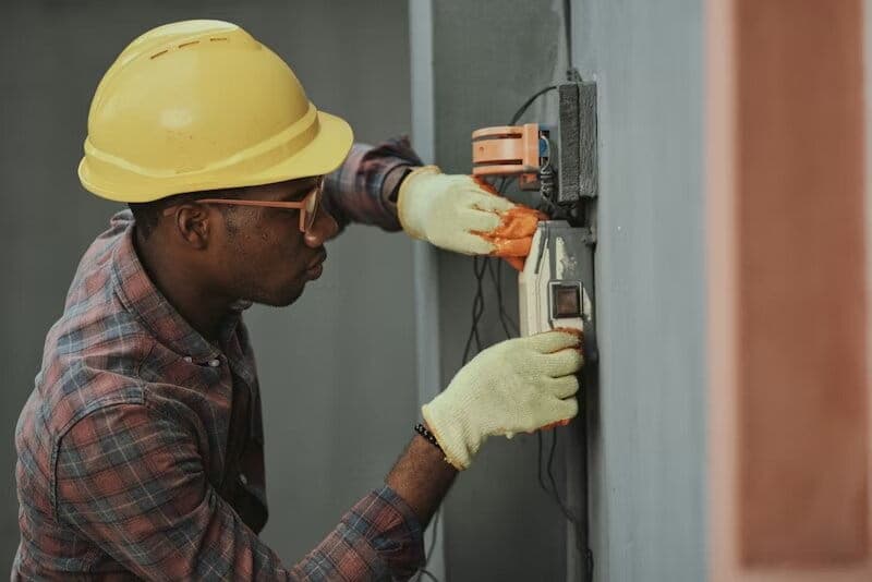 Documentary view of a residential construction repair in progress with new framing and drywall work prior to a Green Restoration post-construction cleanup phase in the tri-state