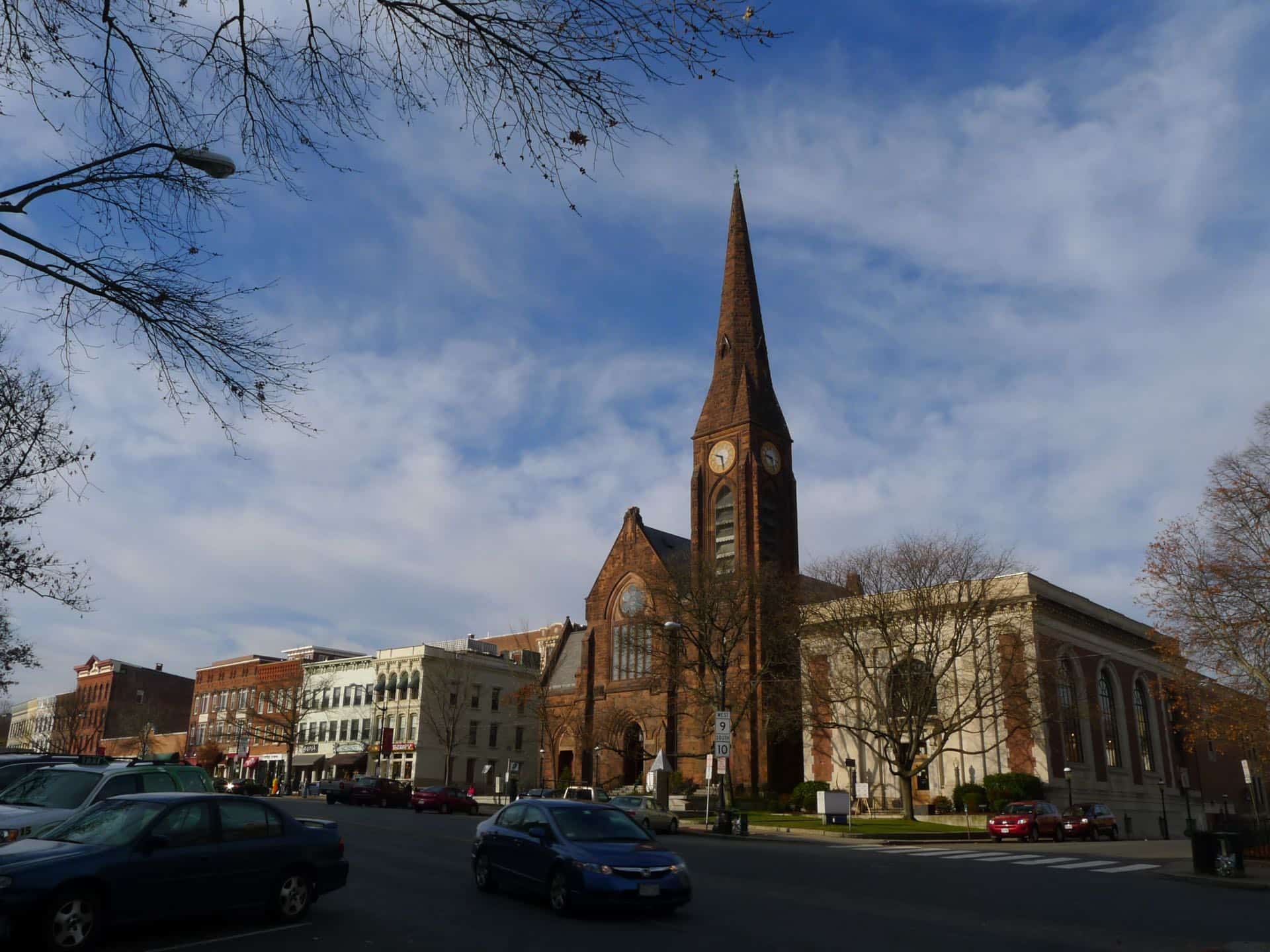 Main Street in Northampton, Massachusetts with the First Church spire. Green Restoration provides 24/7 water, fire, mold, and storm damage restoration in Northampton, MA.